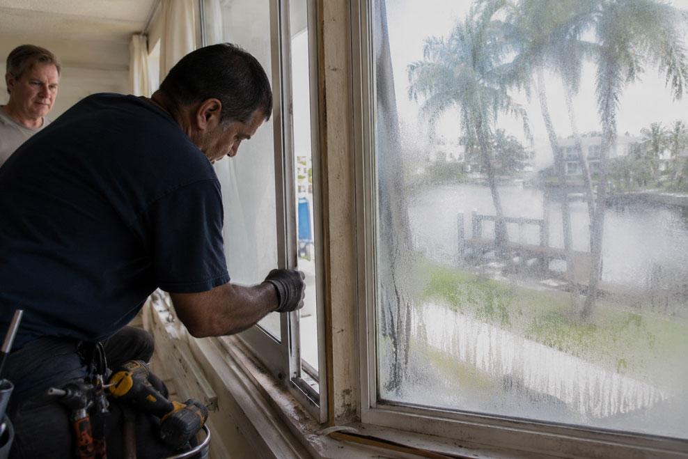 Foggy double pane window glass before replacement